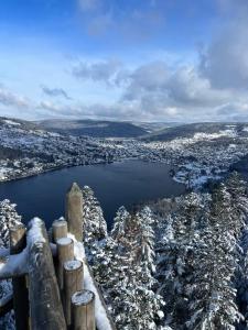 a view of a city in the snow at La Cure Vosgienne in Champdray