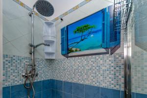 a bathroom with a window with a tree in the shower at Dimora storica monteroni di lecce in Monteroni di Lecce +13 photos