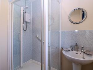 a bathroom with a shower and a sink at The Turbles - Swallows Nest in Castlemorton +25 photos