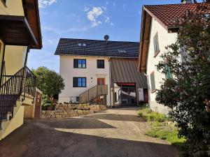 an alleyway between two buildings with a house at Schienerberghütte in Öhningen