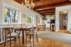 a kitchen and dining room with a table and chairs at Backhaus in Groß Wokern