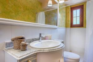 a bathroom with a sink and a toilet at Can Cancus in Capdepera +17 photos