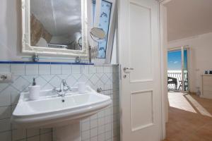 a bathroom with a sink and a mirror at Villa Domus Augusto in Conca dei Marini +41 photos