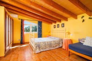a bedroom with two beds and a window at Ses Oliveres en Port Verd in Son Servera +22 photos