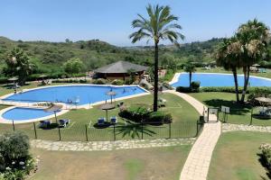 an overhead view of a swimming pool at a resort at Villa with Private Pool in Estepona