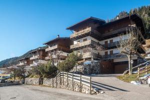 a large building on top of a mountain at Ciasa Apelli in Pozza di Fassa