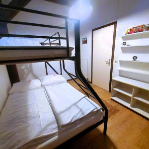 a bedroom with two bunk beds and a closet at Haus Seidelbast in Siegsdorf