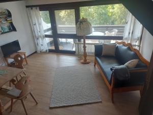 a living room with a couch and a table at Haus Seidelbast in Siegsdorf