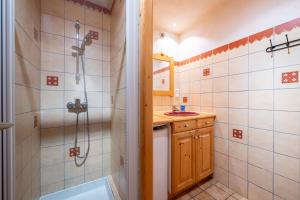a bathroom with a shower and a sink at Appartement Flocon in Champagny-en-Vanoise +19 photos