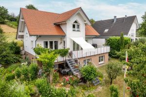 an aerial view of a house with an orange roof at im Oberdorf in Achern