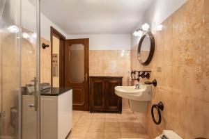 a bathroom with a sink and a mirror at Il Borgo - Aymavilles in Aymavilles +17 photos