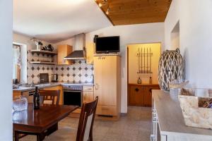 a kitchen with a table and a dining room at Haus Auner Top 4 in Westendorf