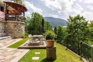 a patio with a table and chairs on a balcony at Haus Auner Top 4 in Westendorf