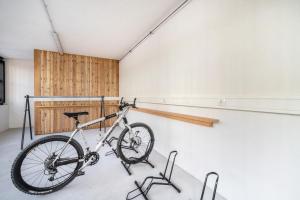 a bike parked in a room with a wall at Apt Zirbe - Nockerhof in Andrian