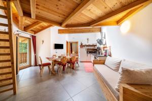 a living room with a couch and a table at Ferienhaus Larch Soge Apt Paula in Racines