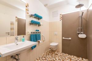 a bathroom with a sink and a toilet and a mirror at Meerfamilie in Noer +19 photos