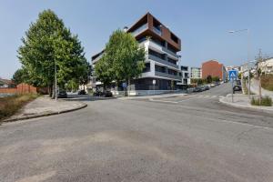 an empty street in front of a building at Vale viver in Vale de Cambra