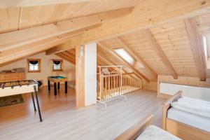 a large attic room with a pool table at Ferienwohnung Seeblick in Bad Heilbrunn