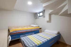 a small bedroom with a bed and a window at Almar in Vigo