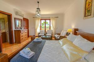 a bedroom with a large bed with towels on it at Can Sanchez in Campos