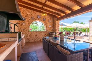 a kitchen with a table and chairs in a room at Can Sanchez in Campos