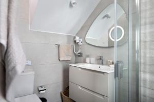 a bathroom with a sink and a mirror at Casa Mara 2 in Playa Quemada +16 photos