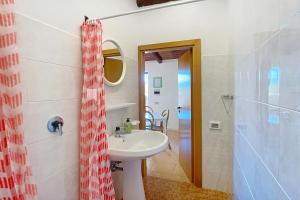 a bathroom with a sink and a shower at La Mignola - Casa Vacanze in Vieste +93 photos