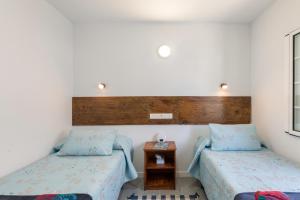 a room with two beds and a table in it at Salitre Tea in Los Cancajos +31 photos