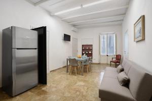 a living room with a couch and a table at Il Cortiletto 21 in Marsala