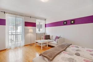 Un pat sau paturi într-o cameră la Appartement Wally