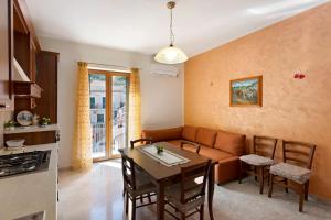 a living room with a couch and a table at Ce Tour - Nonni's Lemon House in Cetara