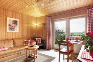 a living room with a couch and a table at Haus Höhensonne in Höchenschwand
