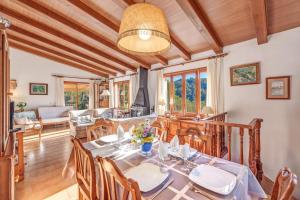 a dining room with a table and chairs at Miravall in Puigpunyent