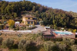 an estate in the hills with a swimming pool at Podere Bucigattolo in Serravalle Pistoiese
