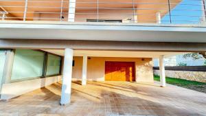 an external view of a building with a red door at Best Leisure in Playa de Palma in Can Pastilla