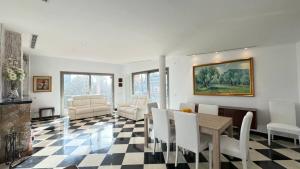 a living room with a table and chairs at Best Leisure in Playa de Palma in Can Pastilla