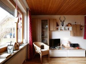 a room with a desk with a computer and a window at Haus Jurisch in Urberg