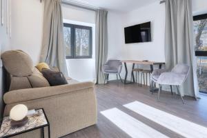 a living room with a couch and a table at Villa Marel in Cerdillo