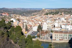 an aerial view of a city with a river and buildings at Canana De Vega in Flix