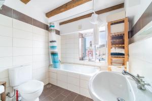 a bathroom with a tub and a toilet and a sink at Contessa di Corfu ii in Corfu +12 photos