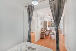 a room with a bed and a living room at Vv Estrella in Puerto de Mogán