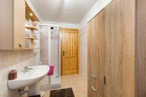 a bathroom with a white sink and a shower at Gioiello Col de Joux in Saint Vincent +18 photos