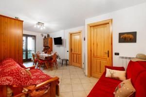 a living room with a couch and a table at Gioiello Col de Joux in Saint Vincent