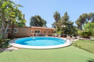 a pool in the yard of a house at Ilusion in Olocau