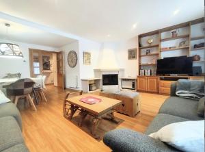 a living room with a couch and a table at Casa Arguis in Eriste