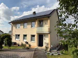 a house with solar panels on the roof at Ferienwohnung S Keller in Plankenfels