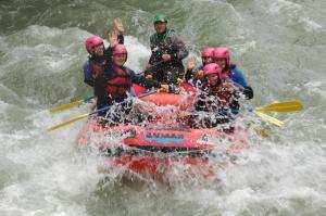 a group of people in a raft in the water at Huberhof Mareit in Mareta