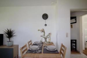 a dining room table with plates and glasses on it at Ferienwohnung No15 in Pfullendorf