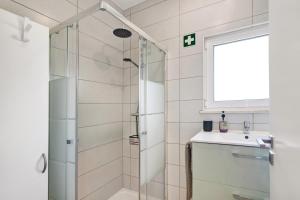 a bathroom with a shower and a sink at Casa Barroca in Alte +13 photos