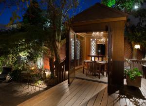 a house with a wooden deck with a dining room at Noe's Nest Bed and Breakfast in San Francisco